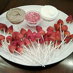 A picture of Fresh Strawberry Pops with Vanilla and Chocolate Whipped Cream.