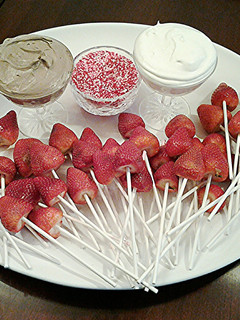A picture of Fresh Strawberry Pops with Vanilla and Chocolate Whipped Cream.