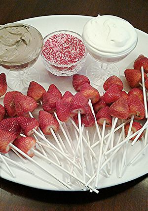 A picture of Fresh Strawberry Pops with Vanilla and Chocolate Whipped Cream.