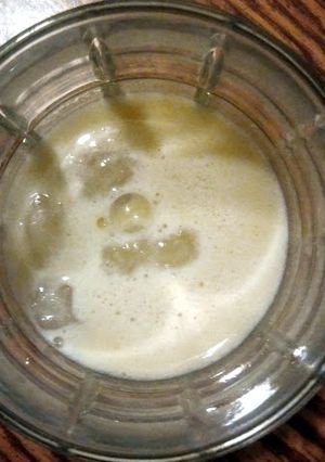 A picture of Apple, orange, banana smoothie.