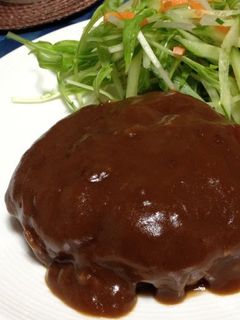 A picture of Homemade Hamburger Steaks Simmered in Demi-glace Sauce.