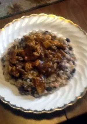 A picture of Tomatillo Chicken over Rice and Beans.