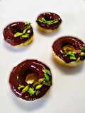 Baked donut with dark chocolate pistachio glazed