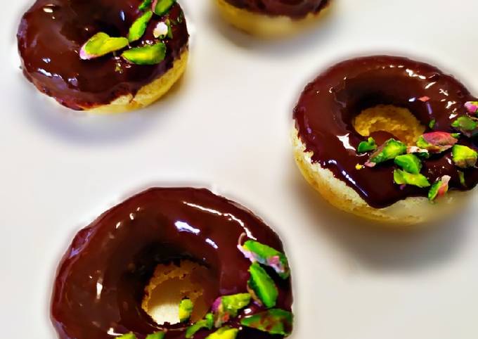 Baked donut with dark chocolate pistachio glazed