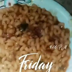A picture of Jollof Macaroni Pasta and beans with vegetables.