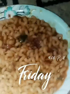 A picture of Jollof Macaroni Pasta and beans with vegetables.