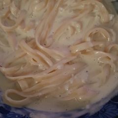 A picture of Fettucine with Alfredo sauce.