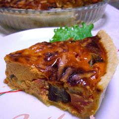 A picture of Tomato Cream Quiche with Eggplants and Tomatoes.