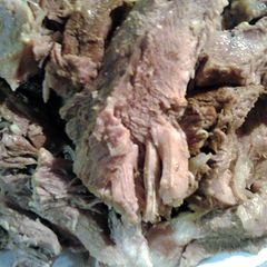 A picture of Boston butt stuffed with shallots stove top.