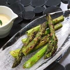 A picture of Grilled Asparagus in Garlic, Oyster Sauce, and Mayonnaise.