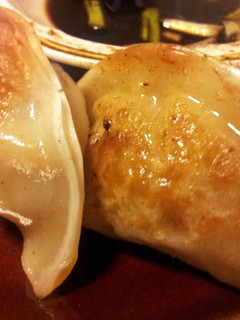 A picture of Chicken/ Shrimp Pot Stickers and Ginger Dipping Sauce.
