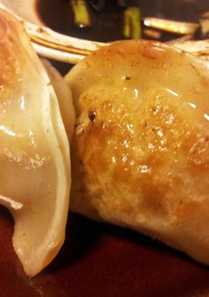 A picture of Chicken/ Shrimp Pot Stickers and Ginger Dipping Sauce.