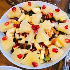 A picture of Fruit & nuts 🍎🌰 🥜 salad.