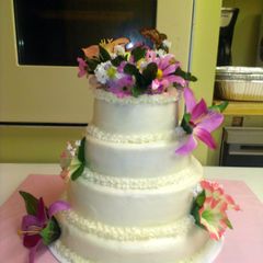 A picture of Orange supreme cake with buttercream frosting.