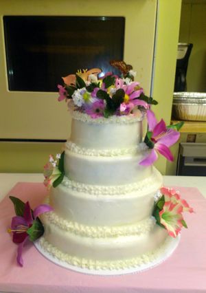 A picture of Orange supreme cake with buttercream frosting.