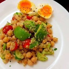 A picture of Quinoa chickpeas salad with avocado and egg.