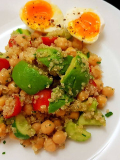 A picture of Quinoa chickpeas salad with avocado and egg.