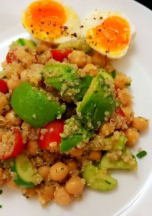 A picture of Quinoa chickpeas salad with avocado and egg.