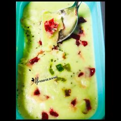 A picture of Kiwi sorbet with homemade tutti frutti.
