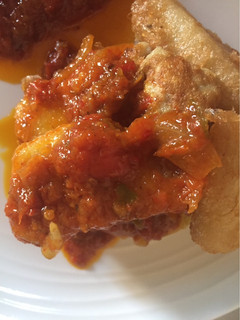 A picture of Fried Yam with tomato sauce.