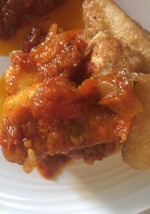 A picture of Fried Yam with tomato sauce.