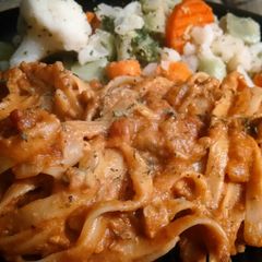 A picture of Breaded clams in tomato sauce.
