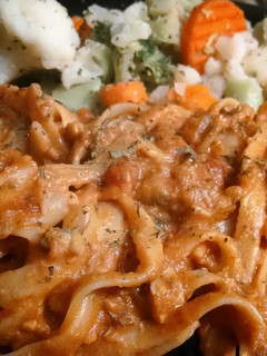 A picture of Breaded clams in tomato sauce.