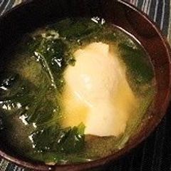A picture of Miso Soup with Spinach and Poached Egg.