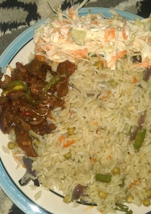 A picture of White fried rice,pepper meat with coils low.
