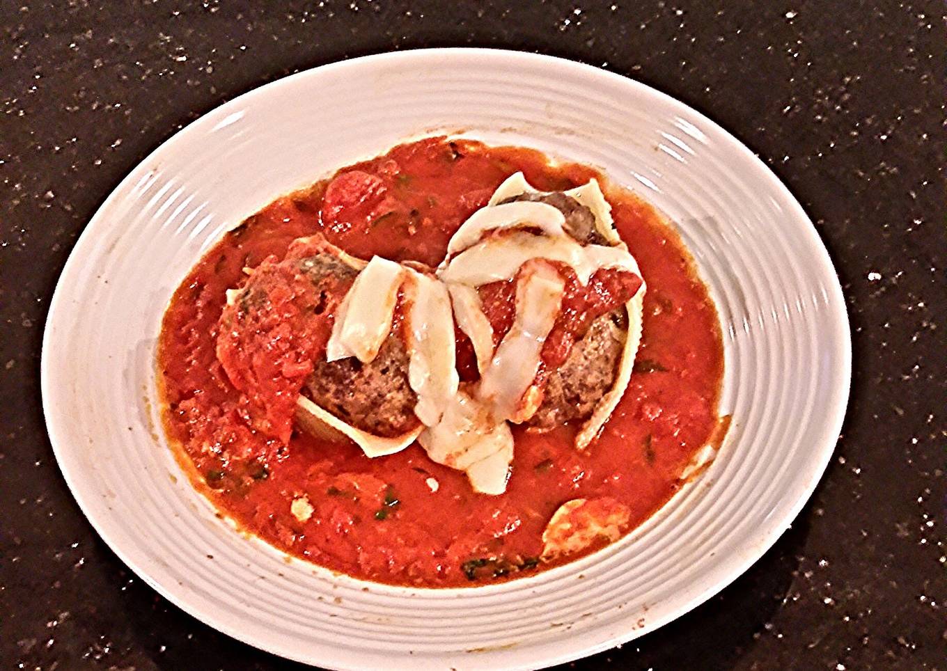 Giant clams with cheese-filled meatballs