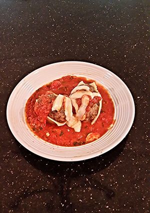 A picture of Cheese Filled Meatball Stuffed Jumbo Pasta Shells.