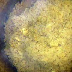 A picture of kichri - whole rice with orange lentils.