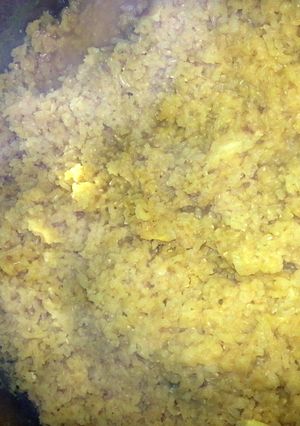 A picture of kichri - whole rice with orange lentils.
