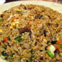 A picture of hibachi style fried rice with ginger sauce.