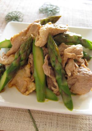 A picture of Pork and Asparagus Tossed in Egg Yolk and Soy Sauce.