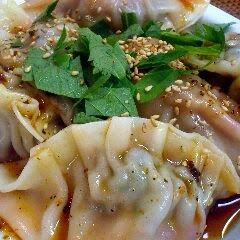 A picture of Silky and Soft, Boiled Gyoza Dumplings with Kimchi.