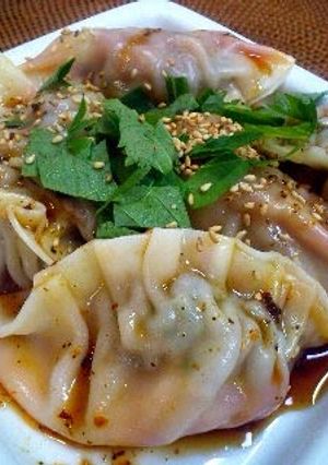 A picture of Silky and Soft, Boiled Gyoza Dumplings with Kimchi.
