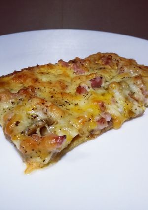 Una foto de Pizza carbonara con base de quinoa