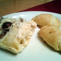A picture of Chicken and bacon lasagna roll ups.