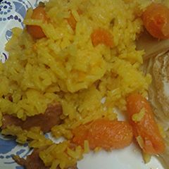Yellow rice carrots with sausage A picture of Yellow rice carrots with sausage.