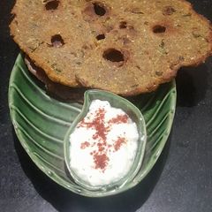 A picture of Multigrain Atta Brinjal & Curd Thalipith.