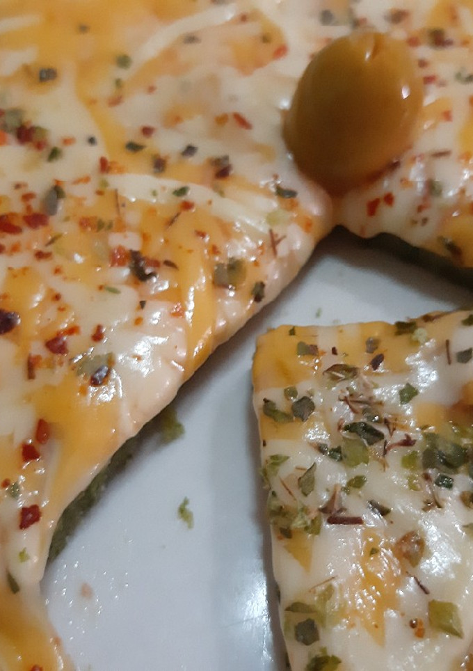 Una foto de Pizza de espinacas sin gluten ni horno