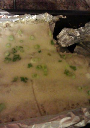 A picture of creamy green enchiladas.