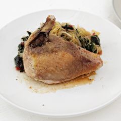 A picture of Guinea Hen with Greens and Spaghetti Squash.