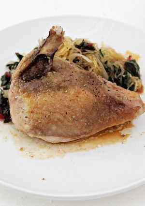 A picture of Guinea Hen with Greens and Spaghetti Squash.