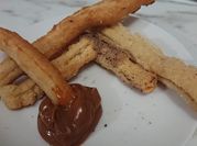 Una foto de churro con manteca