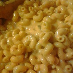 A picture of Macaroni and leftover nacho cheese.