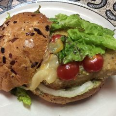 A picture of Chicken Schnitzel On Roll With Basil Aioli (mayo).