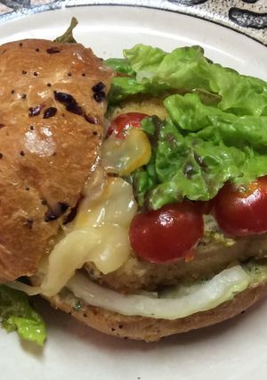 A picture of Chicken Schnitzel On Roll With Basil Aioli (mayo).