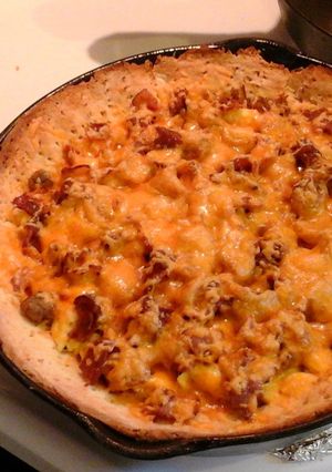 A picture of Deep dish breakfast pizza.